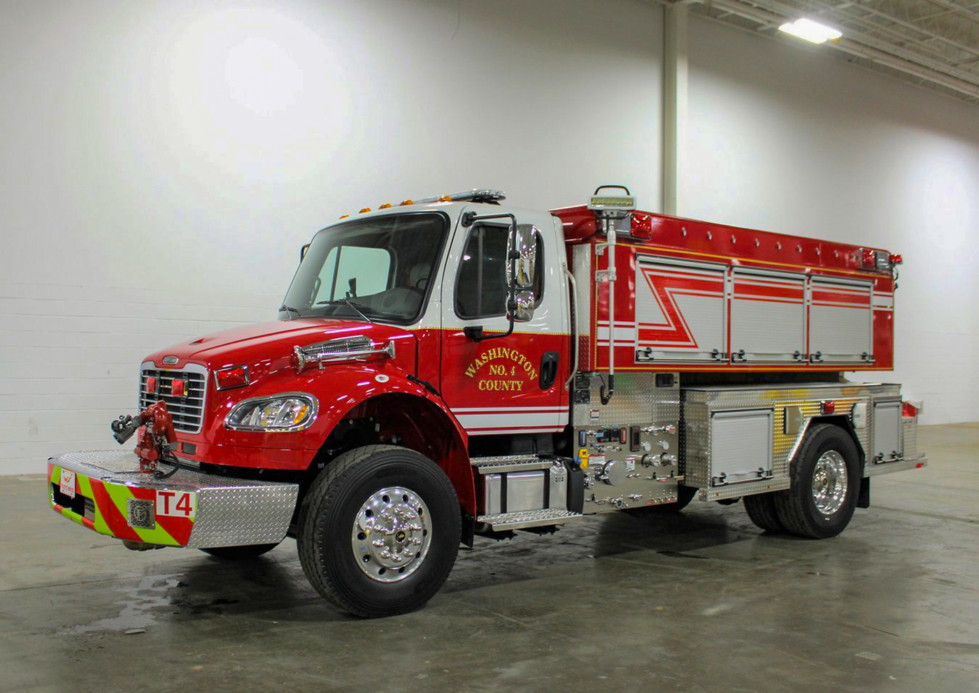Red fire truck with 'Washington County' branding in a warehouse setting