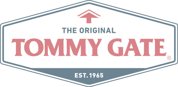 Logo of Tommy Gate with a red arrow on a white background